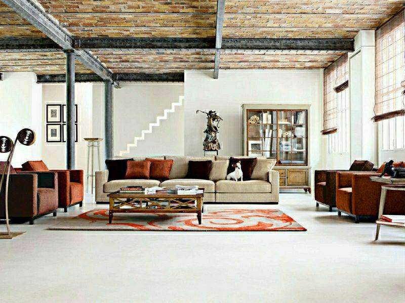 canapé beige composable roche bobois design paris salon intérieur moderne tapis de sol table basse en bois fauteuil en cuir