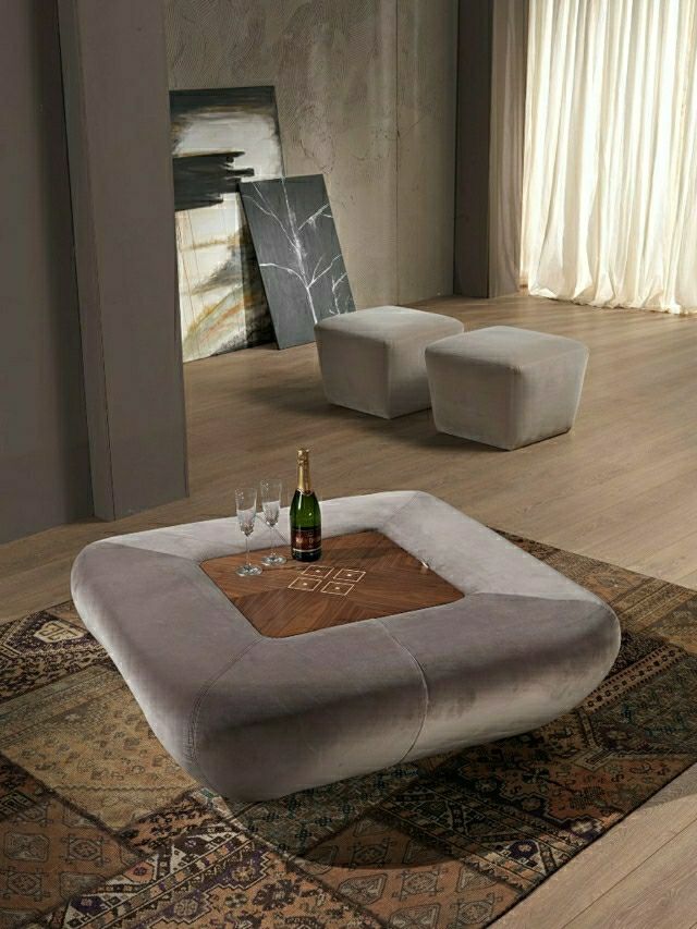 salon design d'intérieur moderne pouf table pouf en bois moderne tableaux décoration idée salon