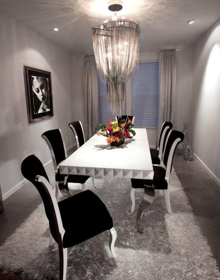salle à manger lampe design suspendu chaise de cuisine design noir table blanche fleurs 