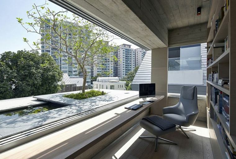 terrasse végétation aménager terrasse arbre balcon déco bibliothèque fauteuil en cuir gris 