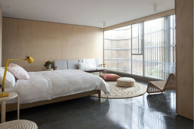 béton ciré chambre à coucher idée tapis de sol beige 