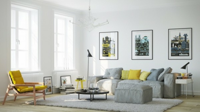 déco salon moderne canapé gris coussins jaunes fauteuil tapis de sol gris clair cadres tableau