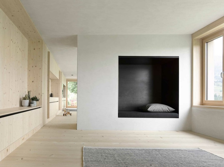 ambiance cosy appartement idée tapis gris cheminée coussin bois 
