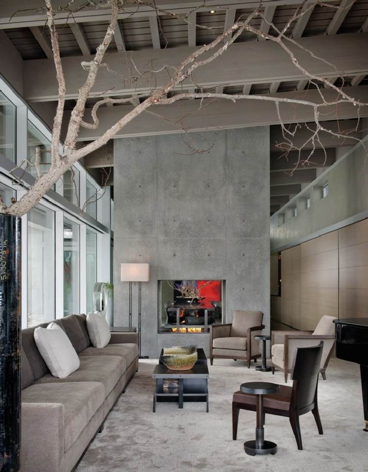 cheminées modernes idée aménagement design fauteuil canapé gris coussins idée tapis de sol table basse salon