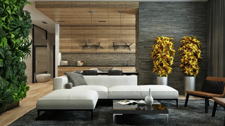 mur gris relief salon design canapé blanc coussins aménagement tapis de sol gris luminaire suspension déco plantes