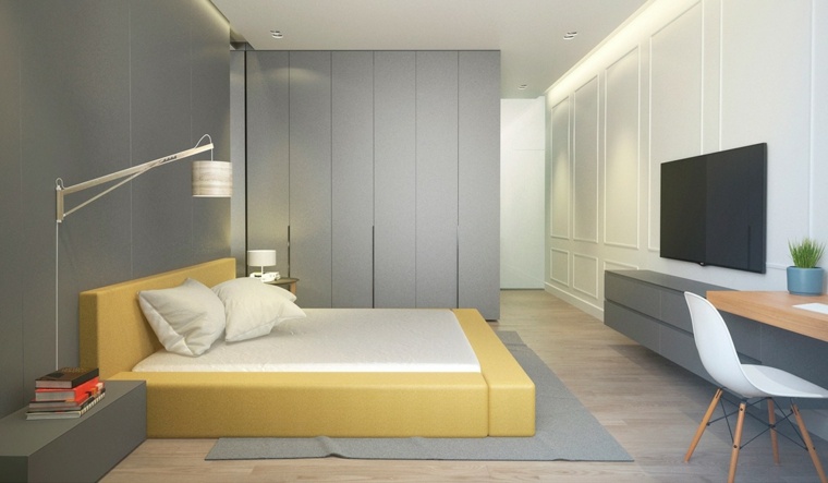 aménager son intérieur chambre à coucher idée aménagement tapis de sol gris coussins blancs meuble télé chaise blanche bureau en bois