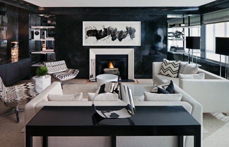 salon design moderne idée tableau blanc abstrait déco intérieur en noir et blanc canapé blanc coussins fauteuils 