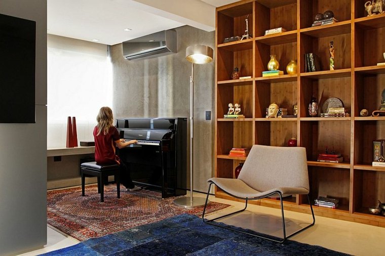 appartement design moderne brésil idée aménagement salon bibliothèque bois rangement fauteuil