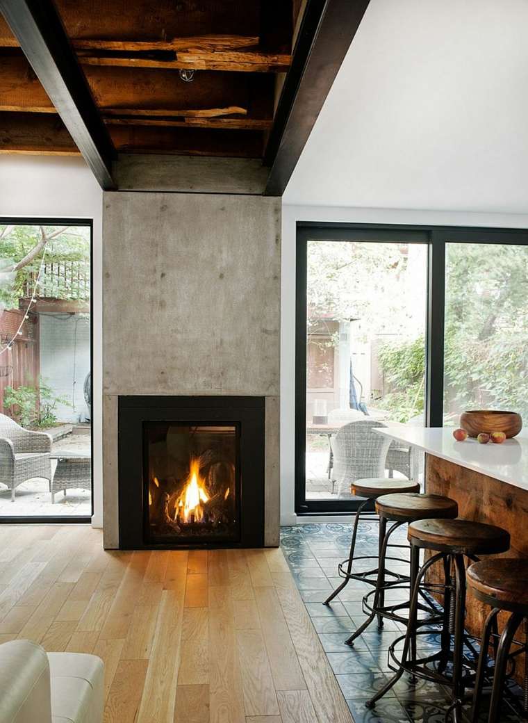 intérieur moderne idée aménagement cheminée béton parquet bois salle à manger tabouret bar 