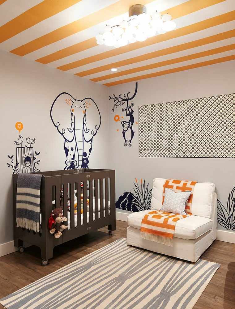 chambre de bébé garçon idée orange blanc aménagement moderne tapis de sol fauteuil blanc lit bébé