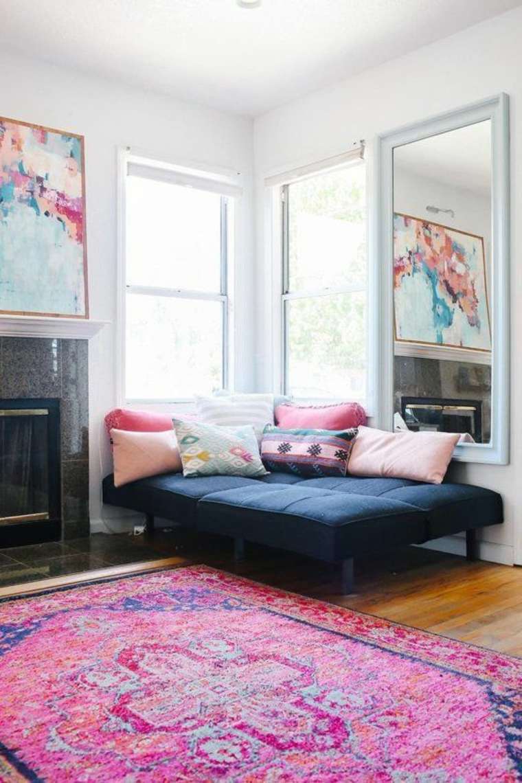 meubles d'angle canapé coussins tapis de sol salon déco tableau mur