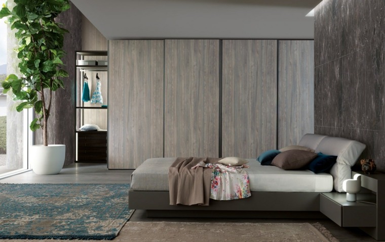 meuble design chambre à coucher idée lit armoire bois tapis de sol plante idée étagères rangement 