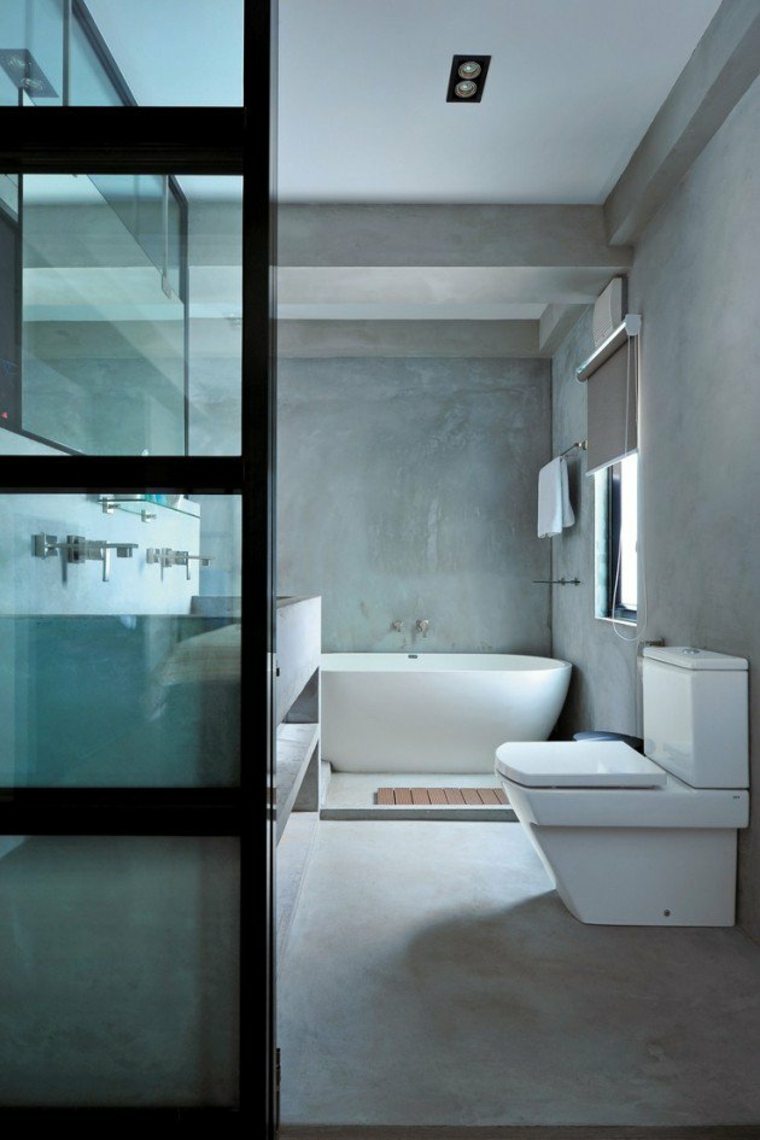 salle de bain design moderne béton ciré idée baignoire tendance moderne cabine douche