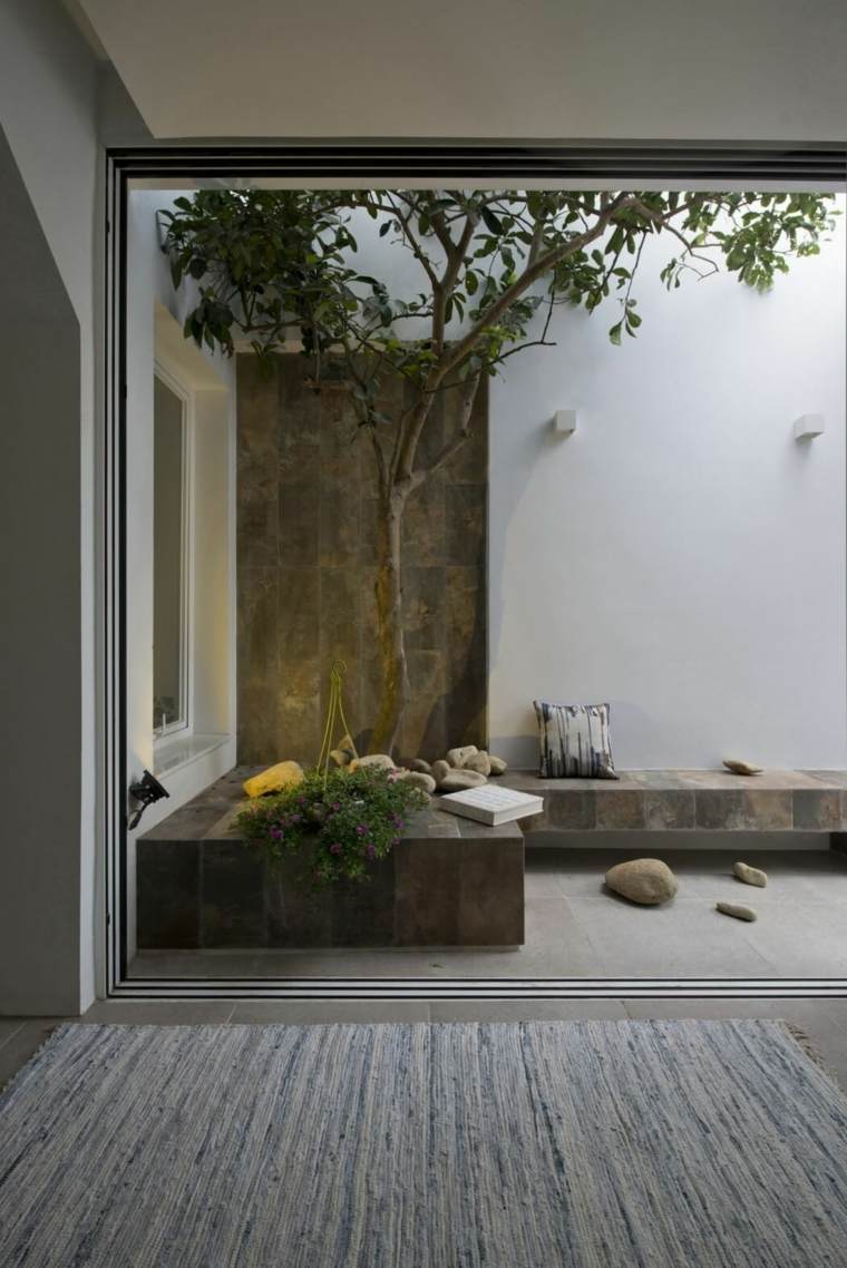 appartement avec jardin design déco extérieure pierre banc en pierre design tapis de sol