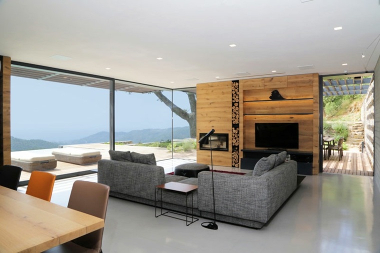 salon moderne canapé d'angle gris tendance table en bois chaise cheminée 
