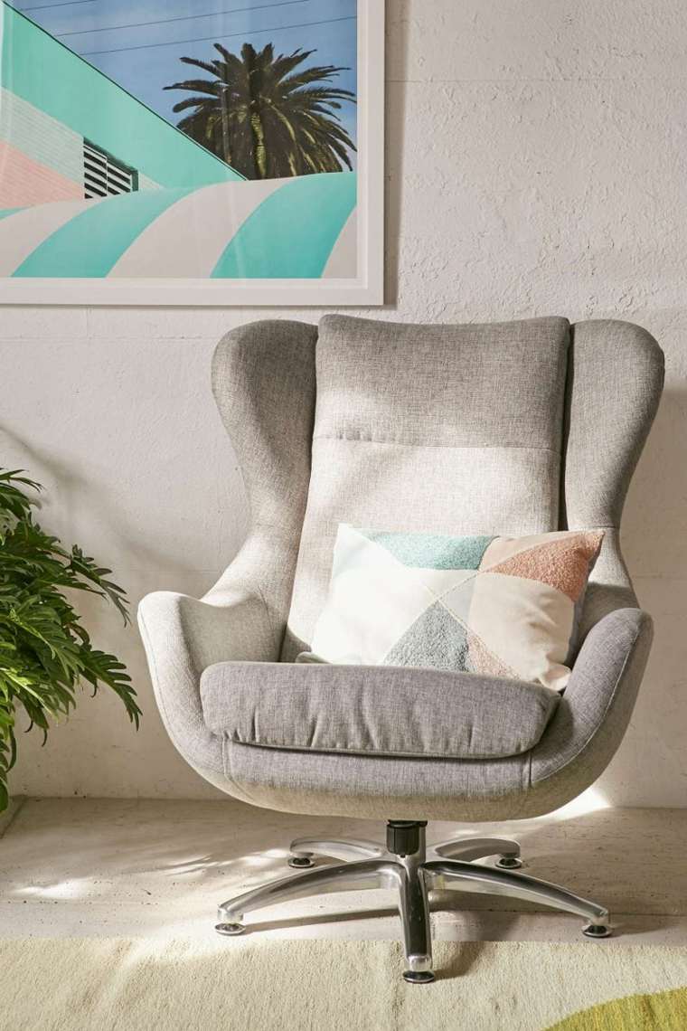 intérieur décorer idée mur cadre photographie fauteuil oeuf design moderne coussins