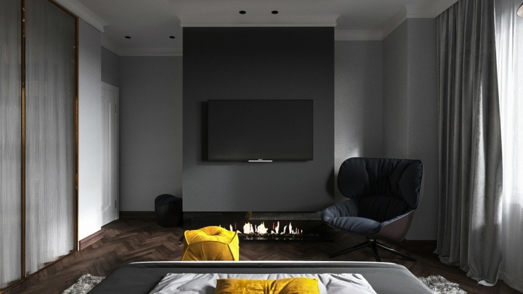 chambre à coucher cheminée idée parquet bois fauteuil télévision
