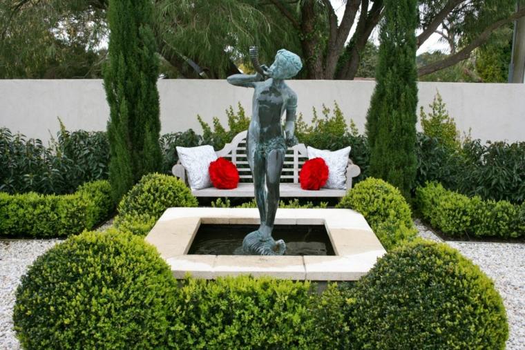 décorer son jardin fontaine de jardin banc de jardin blanc coussins rouges 