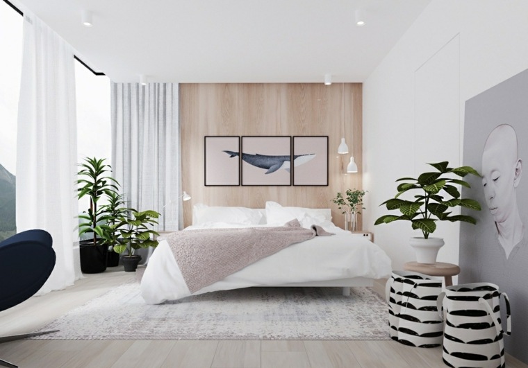 intérieur moderne lit déco mur cadres plante en pot coussins idée tapis sol