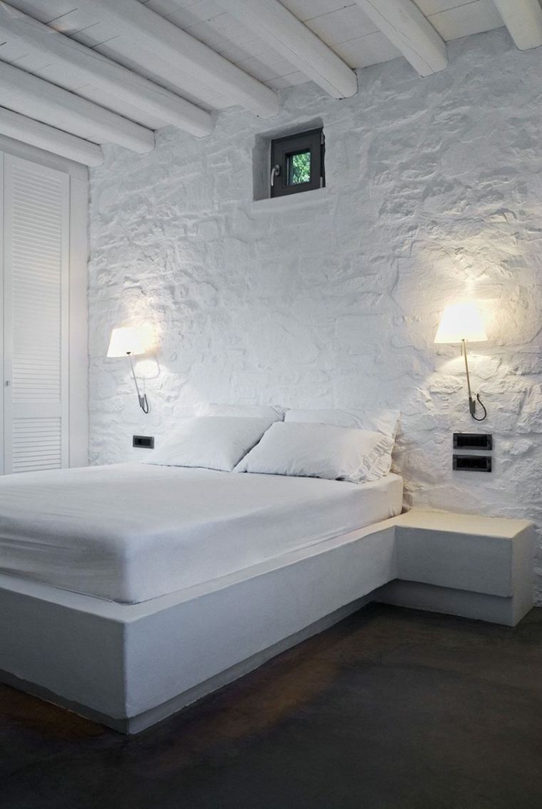 intérieur design maison en pierres apparentes chambre à coucher