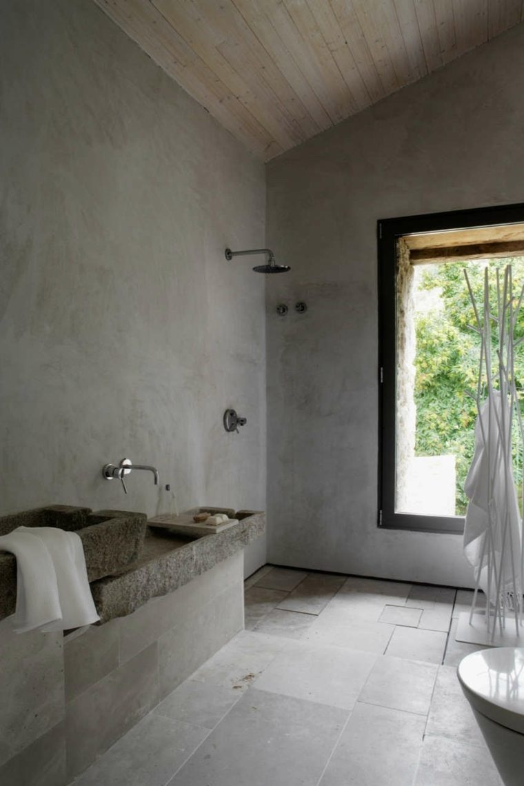salle de bains design baignoire moderne béton ciré cabine douche