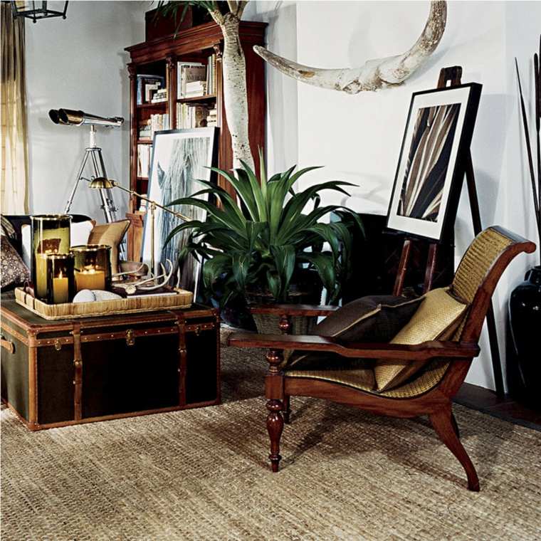 fauteuil de planteur intérieur thème colonial tapis de sol beige table basse coussins