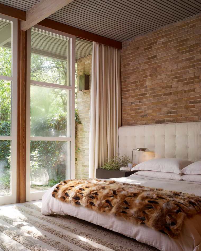 design intérieur chambre à coucher mur briques lit tête de lit