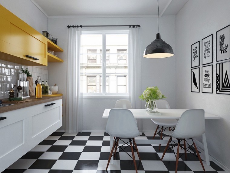 cuisine moderne armoire de cuisine jaune table à manger blanche carrelage noir et blanc