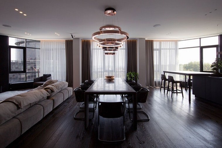 appartement rénové design table à manger luminaire cuivre