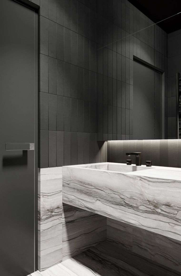 carrelage en noir et salle de bain avec meuble en marbre