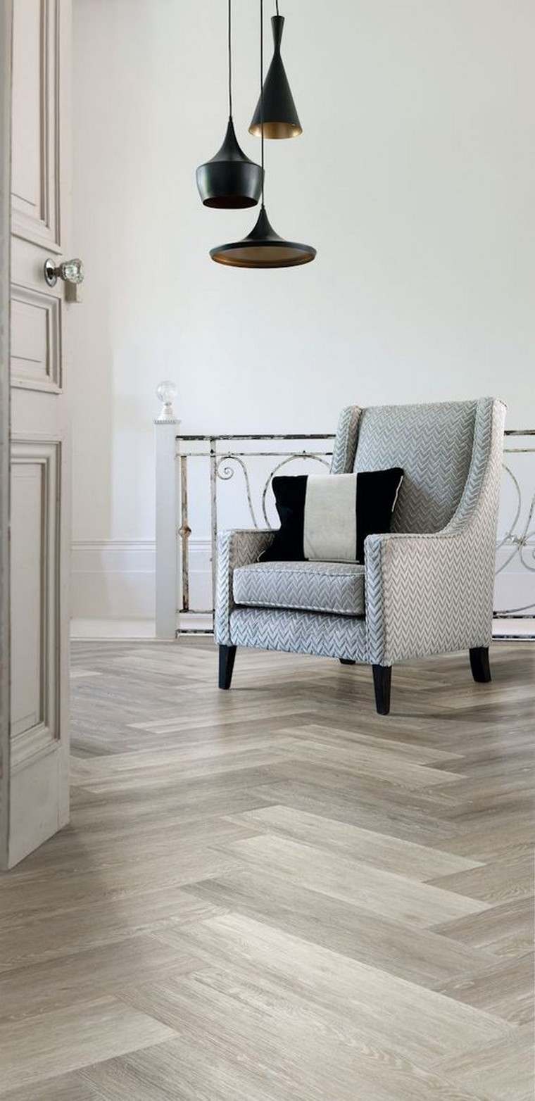 sol gris salon design fauteuil coussins intérieur