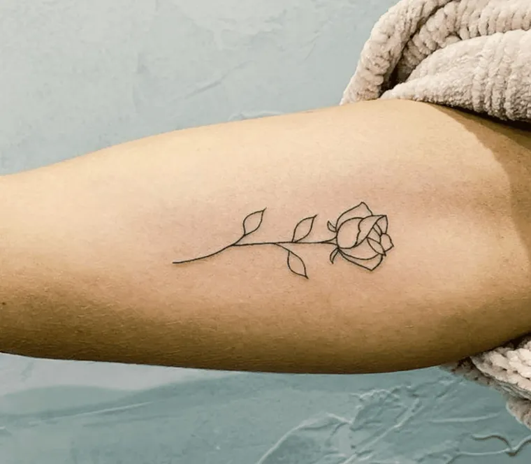 delicate flower tattoo for women