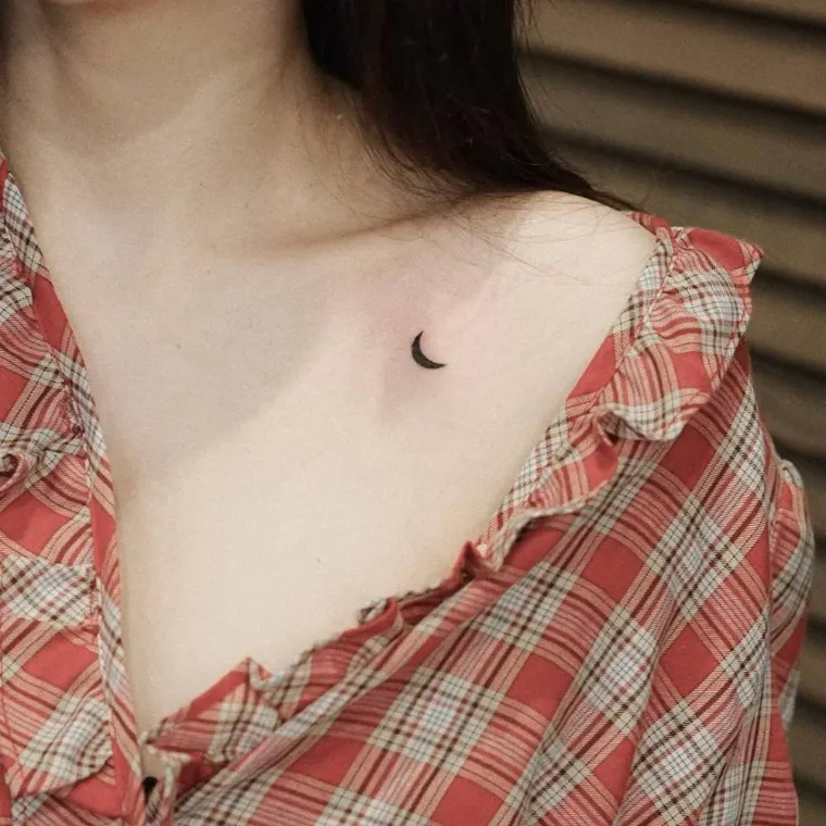 significant tattoo woman moon clavicle