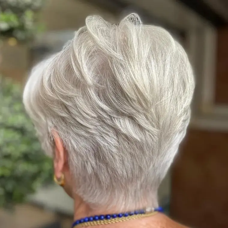 short haircut platinum blond woman 65 years old trend