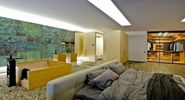 chambre joint lit baignoire couleur bois pierre chaleureux