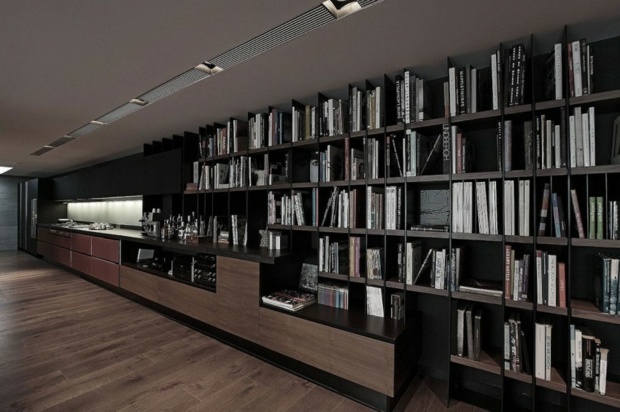 immense meuble bibliothèque étend sol au plafond
