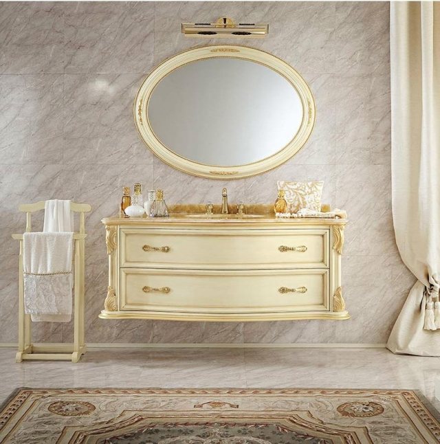 meuble-sous-lavabo-style-classique-suspendu-blanc-ornements-dorés-cadre-miroir-forme-ovale-doré meuble sous lavabo