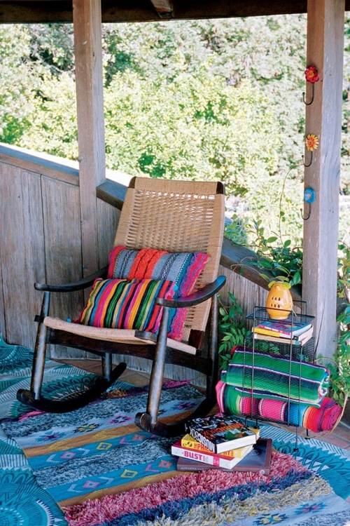 veranda bois tapis fauteuil